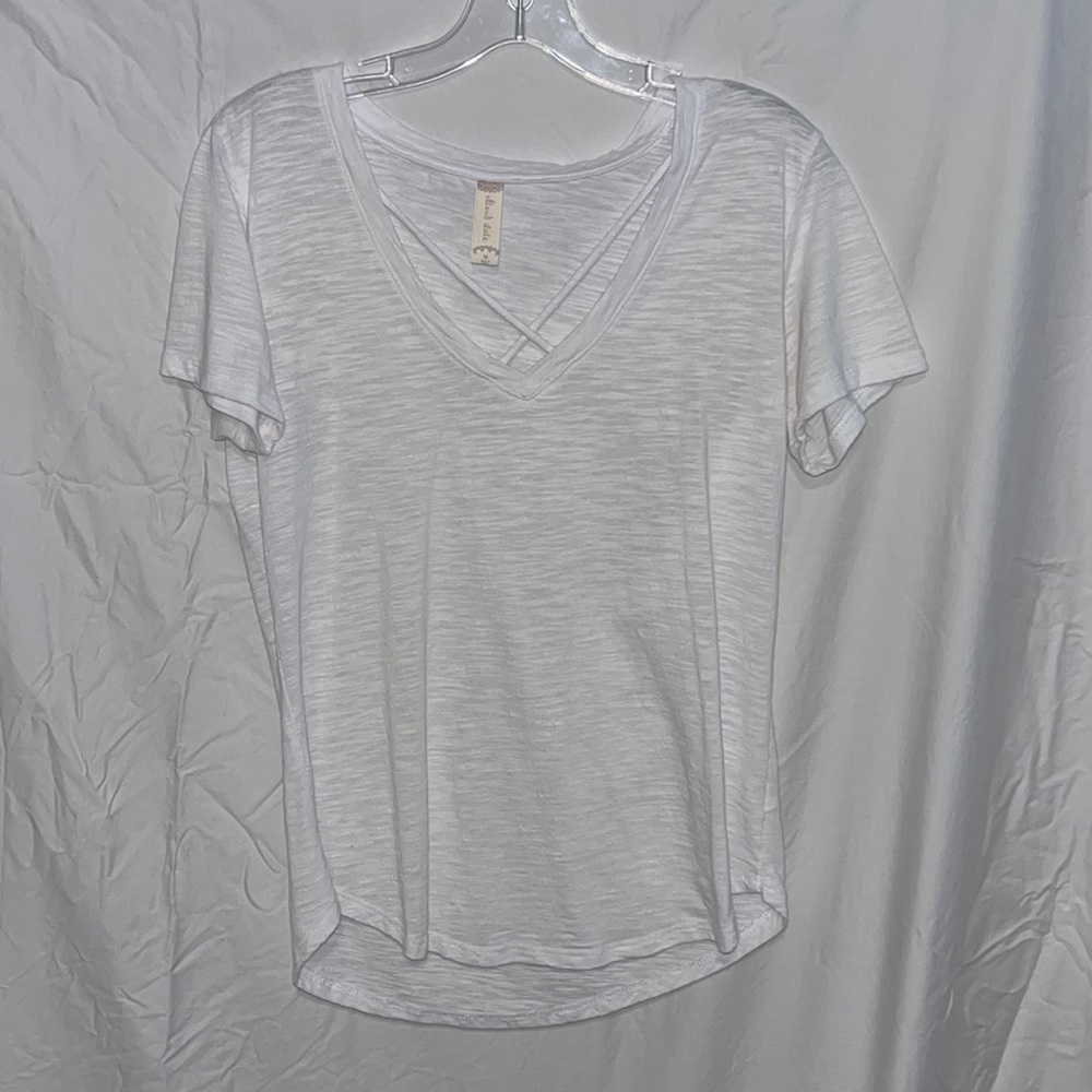 Medium white tee with cross in the front from boutique
